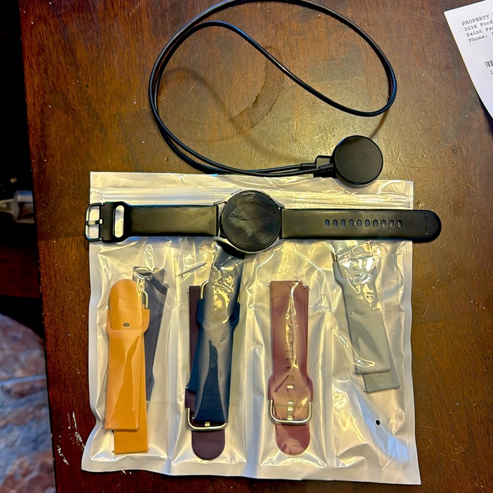 Samsung Galaxy 4 Watch with 7 bands and charger